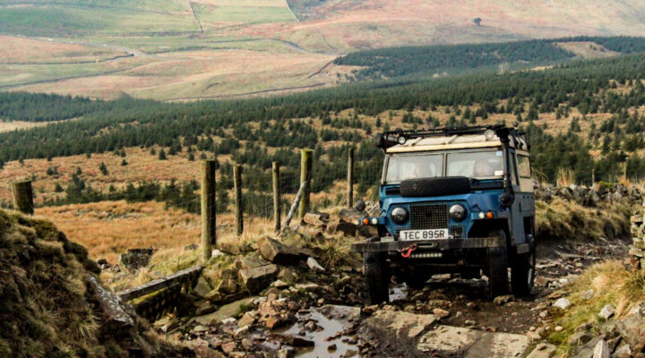 Single off-road 4x4 vehicle driving a scenic green lane in the UK, representing an All Terrain UK Affiliate Member exploring responsibly.