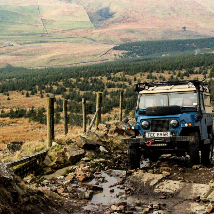 Single off-road 4x4 vehicle driving a scenic green lane in the UK, representing an All Terrain UK Affiliate Member exploring responsibly.